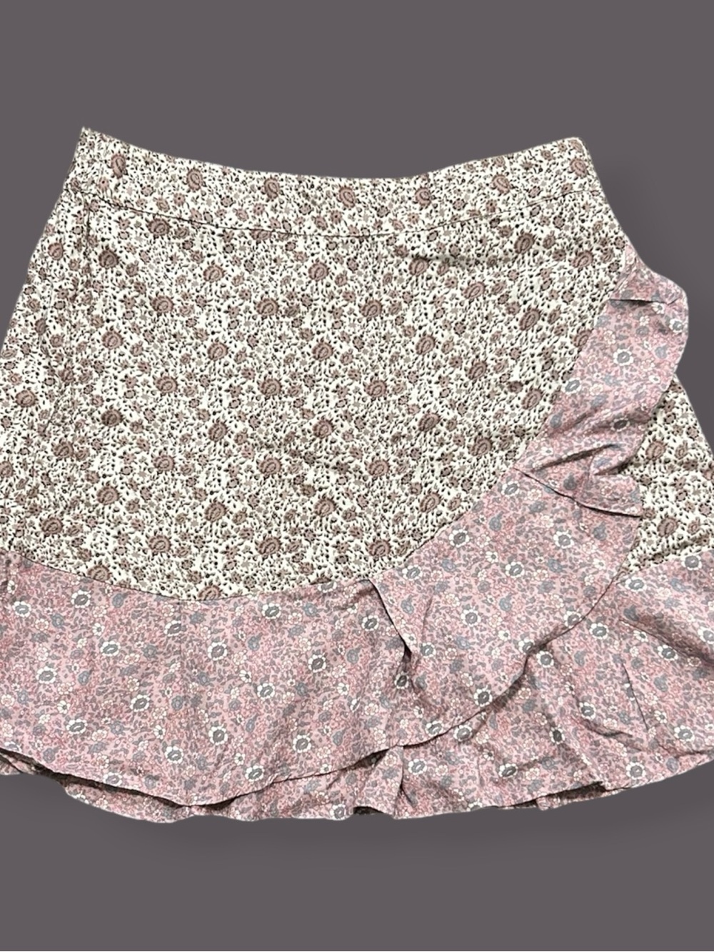 NWT Sim & Sam faux wrap mini skirt featuring a pink floral pattern with a ruffle